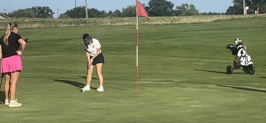 Mahlia McCane on Hole 9 putting for birdie for the second time in as many holes in New Richmond on Aug. 24.