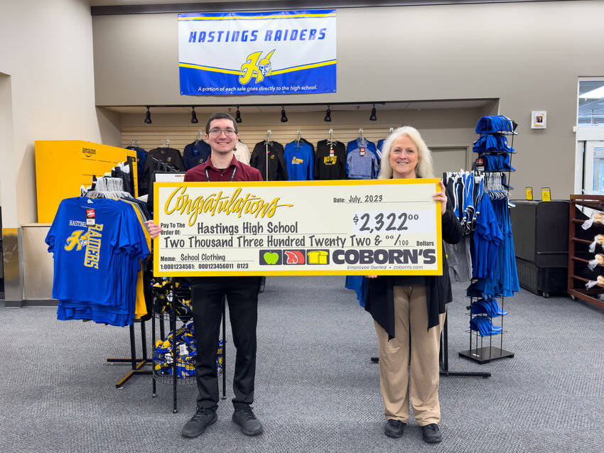 Store Manager Keith Veiths and Floral &amp; Gift Manager Tamara Jacobs held the giant check for the donation to Hastings High School. This year they donated $2,322 to HHS.