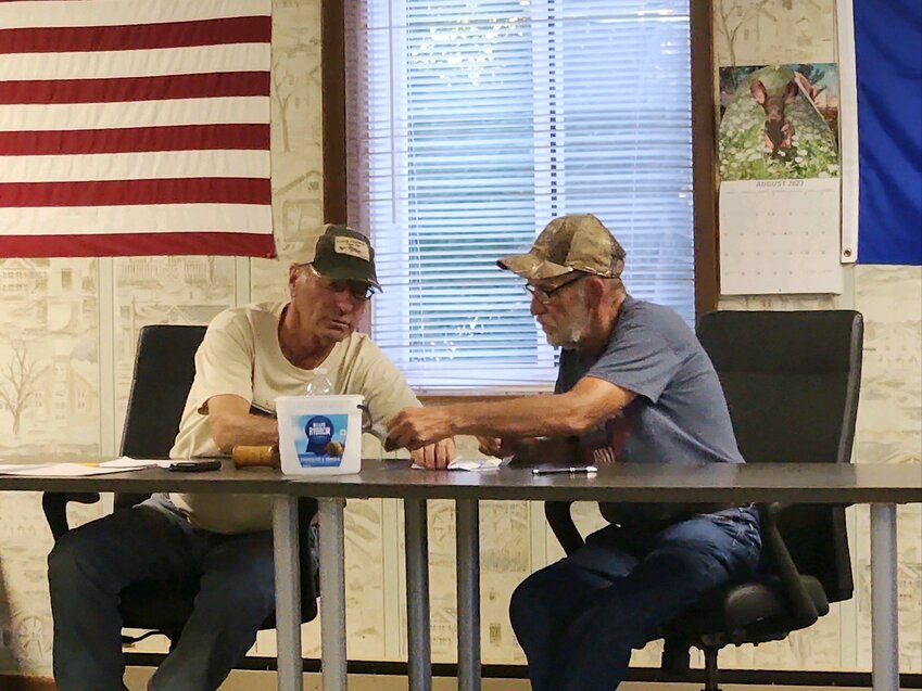 Chairman Jerry Jacks and Supervisor Bob Kodl counted the paper ballots that were collected in the ice cream pail from the town residents that attended the special meeting.