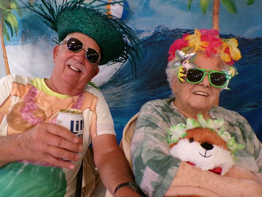 Just a couple of beach bums, Slim and Jean McDonough, during Plum City Care Center&rsquo;s Happy Hour.