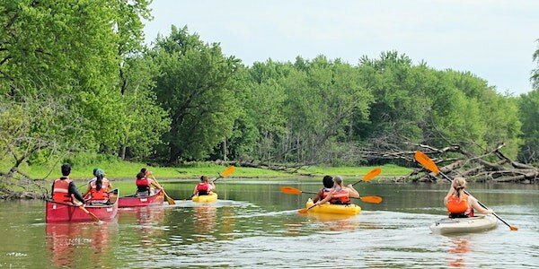 Kayakers explore the Mississippi, guided by a park ranger.