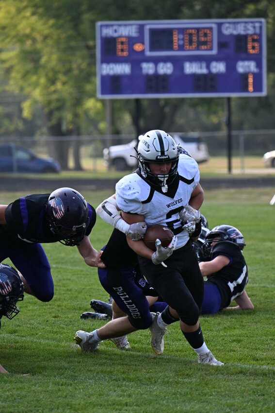 Blake Allen breaks tackles and leads the way for the Wolves on Saturday in Boyceville.