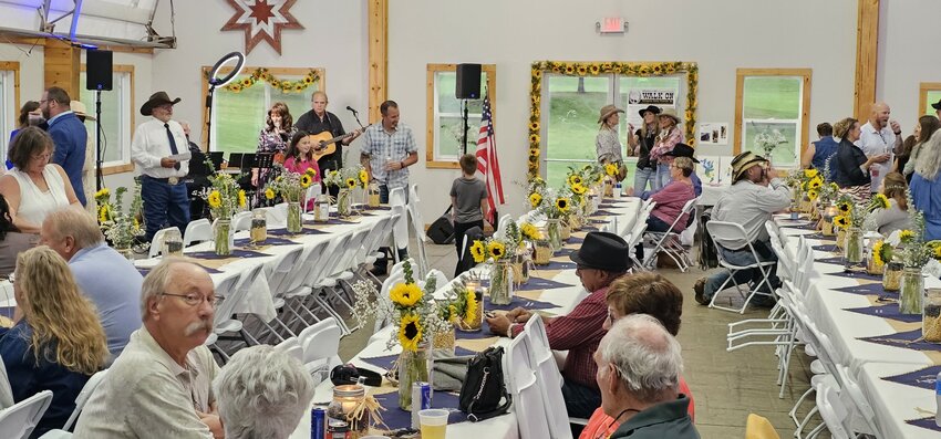 Attendees listen to music and bid on silent auction items at the Walk On Therapeutic Riding Center&rsquo;s Fall Gala Sept. 23.