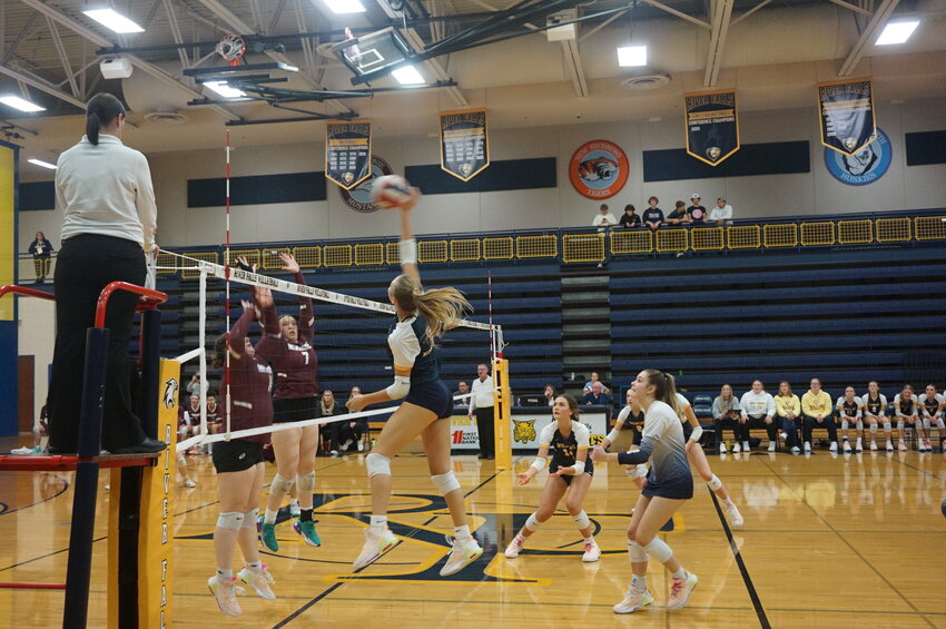Amelie Pankonin goes for the kill against the Menomonie Mustangs in the first round of the playoffs on Thursday.