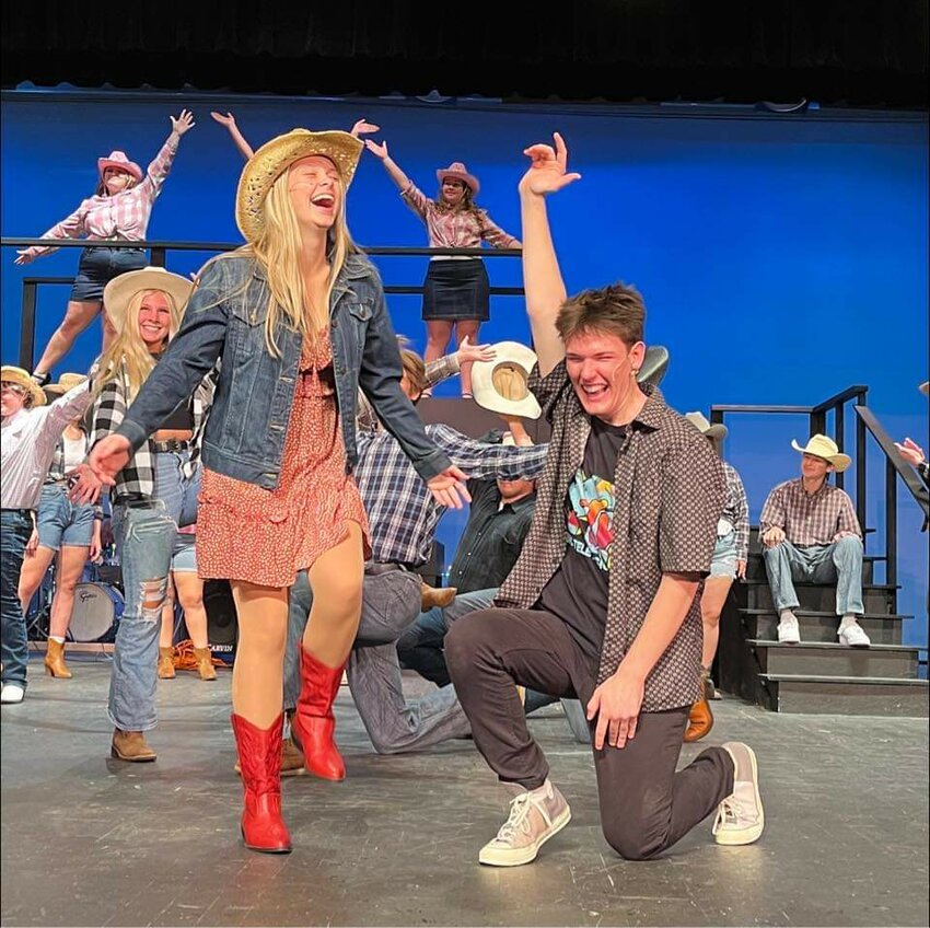 Footloose lead actors Lander Levers and Ava Brookshaw light up the stage during a recent dress rehearsal at Ellsworth High School.