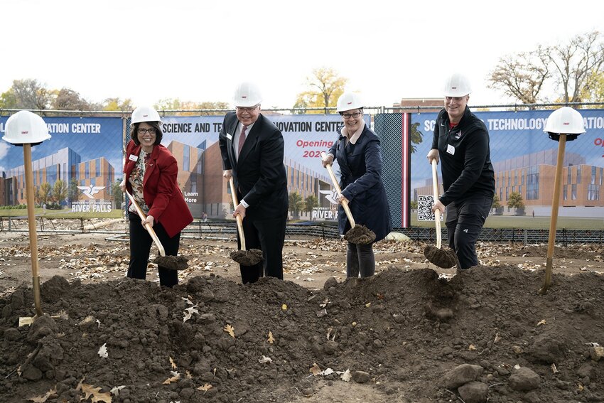 From left, UW-River Falls Chancellor Maria Gallo, Universities of Wisconsin President Jay Rothman, and River Falls business owners and UWRF alums Kristi and Jeff Cernohous participate in a groundbreaking ceremony Monday for the Science and Technology Innovation Center (SciTech) building under construction at the university.