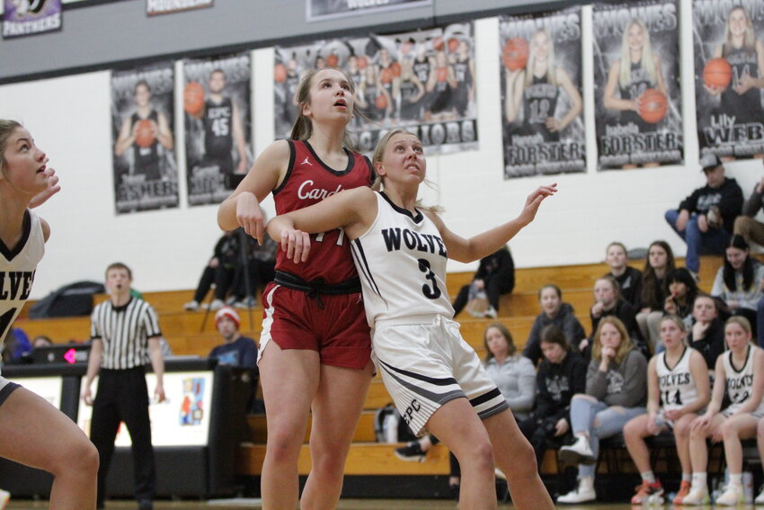 Elmwood/Plum City then sophomore Hailey Webb and Spring Valley junior forward Charli Vanasse battle for a rebound during the rivalry game in Elmwood last year on Friday, Feb. 3.