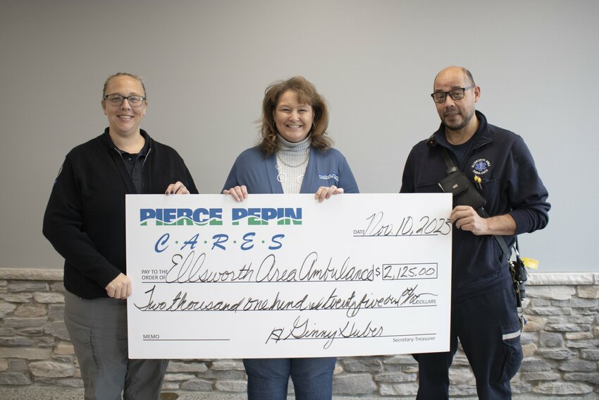Barb Bee (center), PPCS senior accountant, presented Ellsworth Area Ambulance&rsquo;s Jessi Willenberg (left) and Tony Korder (right) with a $2,125 check to create mass casualty treatment kits.