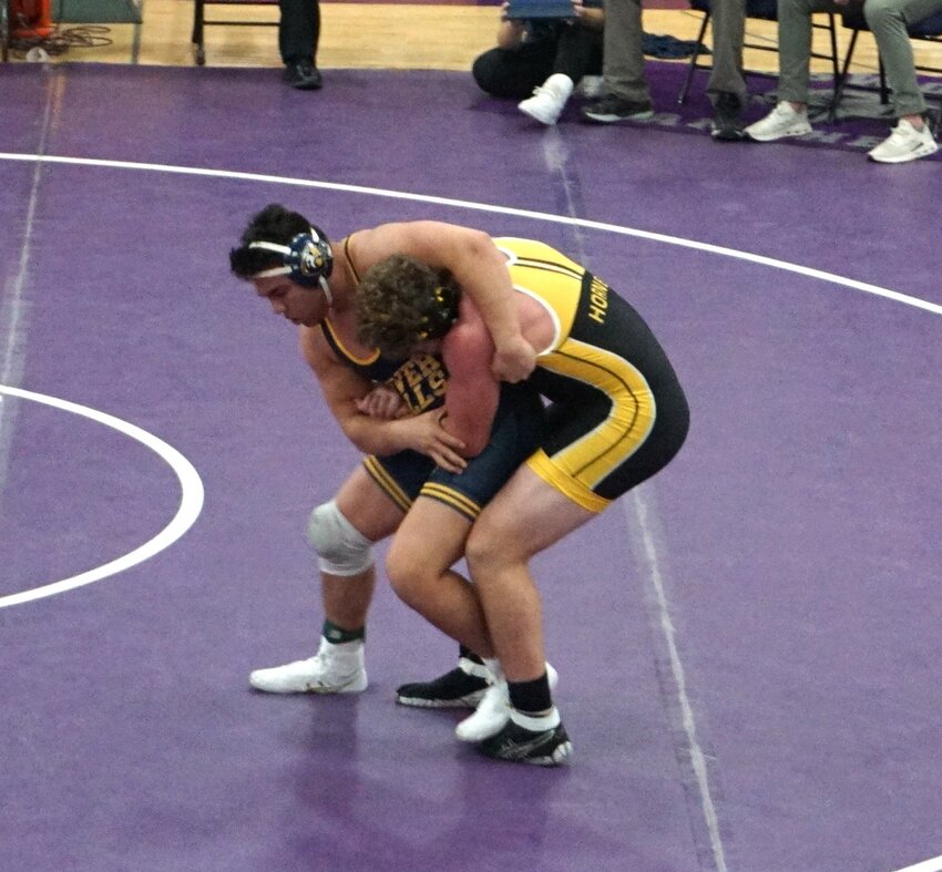 2022 State Competition qualifier junior Lincoln McCarty grapples with his opponent at the 59th Annual Ellsworth Invitational on Saturday.