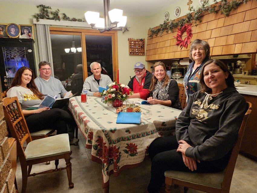 The cast of Great River Road Theatre&rsquo;s winter dinner theater production met at Director Judy Johnson&rsquo;s home Sunday, Dec. 17 for a rehearsal. (From left): Krista Christiansen, Mark Andrle, Scott Halverson, Aaron Denn, Marie-Anne Haudegand-Deiss, Johnson, and Rebecca Denn.