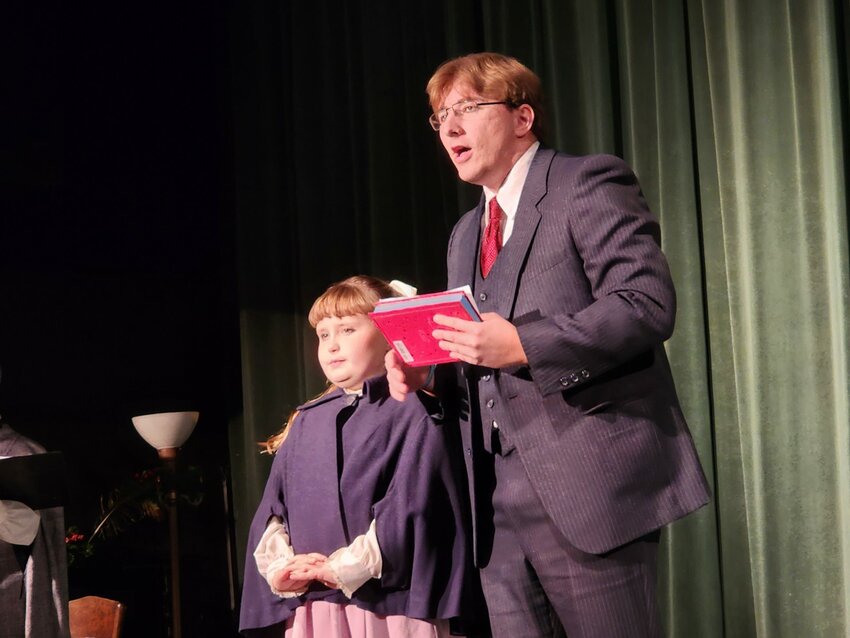 Father, played by Mason Johnson, and Daughter, played by Amira, welcome the audience to &ldquo;Christmas Every Day&rdquo; at the Spring Valley Stagehands Theatre on Sunday, Dec. 17. Father told a story about a little girl who wished for it to be Christmas every day.