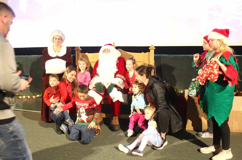 Above, Elf on a Shelf and the Abominable Snowman welcomed theatergoers to the free movie Dec. 16, sponsored by the Stanley Area Chamber of Commerce.