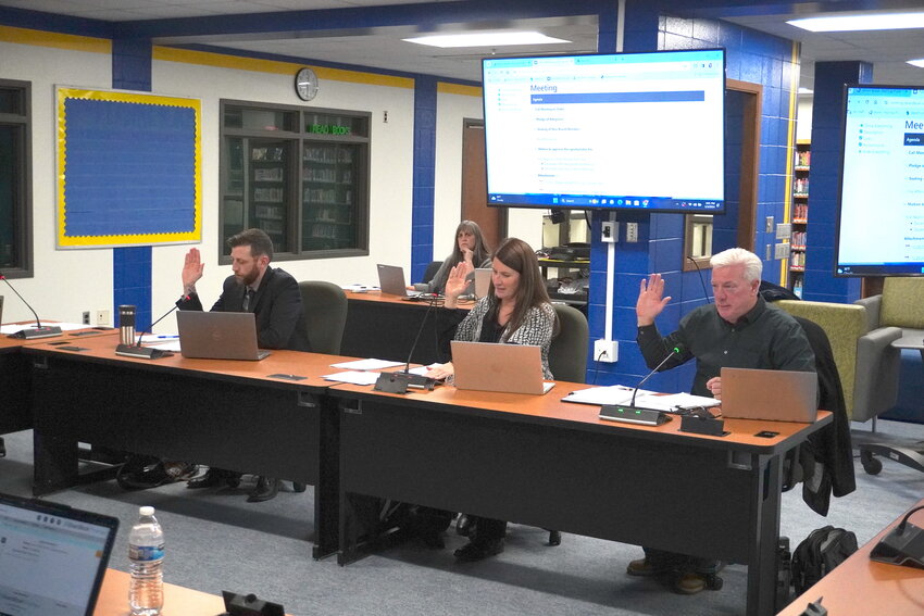 Taking the Oath of Office at the Jan. 3 organizational meeting of the Hastings School Board were Jenny Wiederholt-Pine (pictured at left) and (from left) Matt Bruns, Melissa Milner and Philip Biermaier (pictured at right).