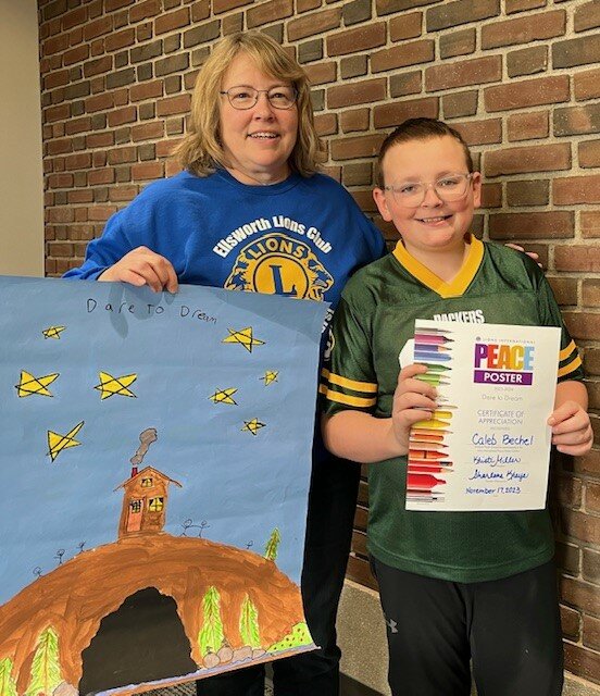 Ellsworth Lions Club President Kristi Miller is pictured with the winners of the 2023-24 Elsworth Lions Club Peace Poster contest. Caleb Bechel earned second, while Kyle Lecheler received first.