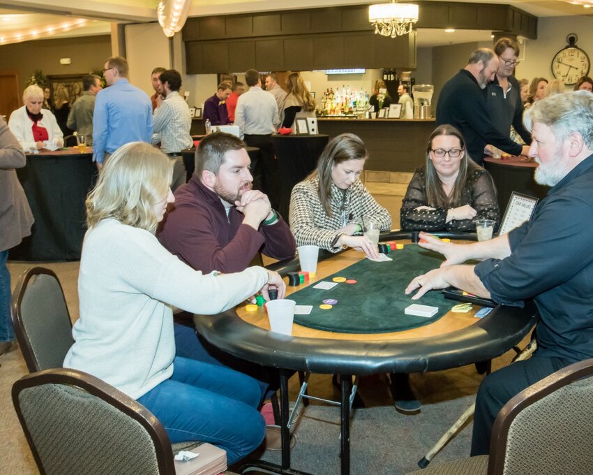 Attendees at the 2023 Our Neighbors&rsquo; Place Casino Night play table games at Kilkarney Hills.