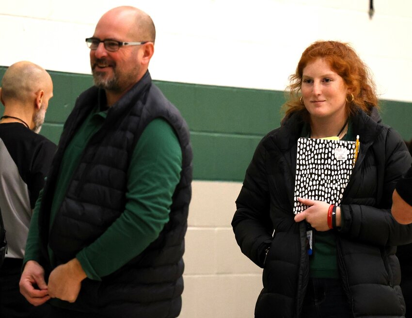 Dad Tony and daughter Delaney smile as they walk off the court after a recent Park High School B squad basketball game.