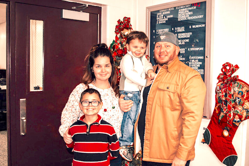 The Rucker Family is committed to making sure that no child goes cold this winter. Above from left are Dustin, Bennett, Christa, and Eli (front).