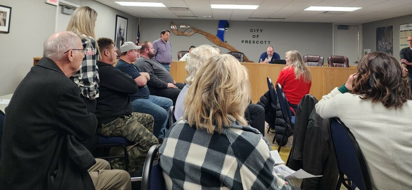 Jan Anderson, her family and supporters attend a Jan. 18 Prescott riverfront improvement project public information meeting and listened as Alderperson Pat Knox speaks to those gathered.