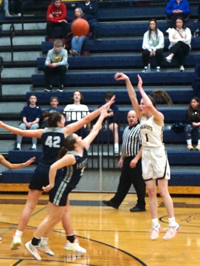 Hailey Quinn drains two three-pointers in a row in River Falls' loss to Hudson at home on Saturday night.