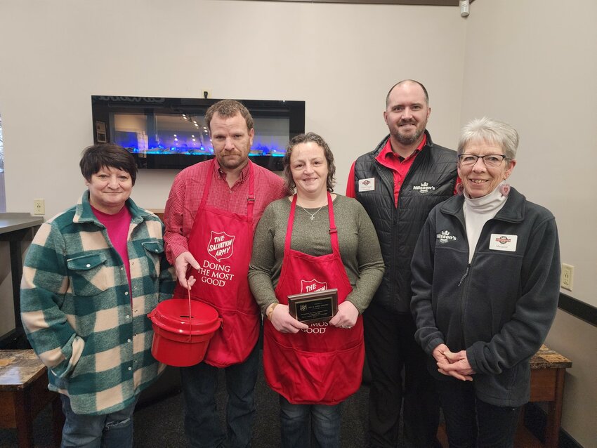 (From left): Salvation Army Ellsworth Volunteer Coordinator Rita Niesen, James Okrutny, Amy Okrutny, Nilssen&rsquo;s Store Manager Shawn Eggen, and Margaret Volenec celebrate the Okrutny&rsquo;s plaque from Salvation Army for their 50 hours of service.