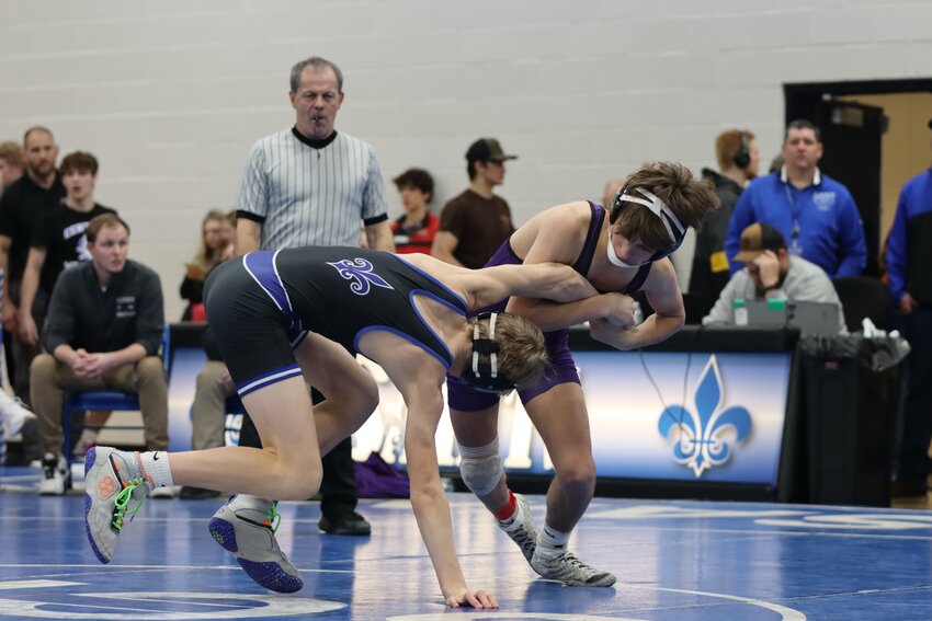 Carson Wright wrestling his way into the sectional tournament on Saturday at the St. Croix Falls Regional Tournament.