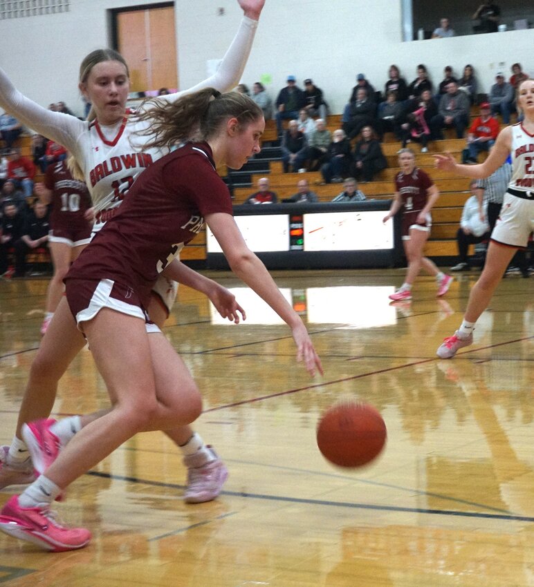 Lila Posthuma pushes to the inside to make a play in Prescott's loss in Baldwin on Friday night.