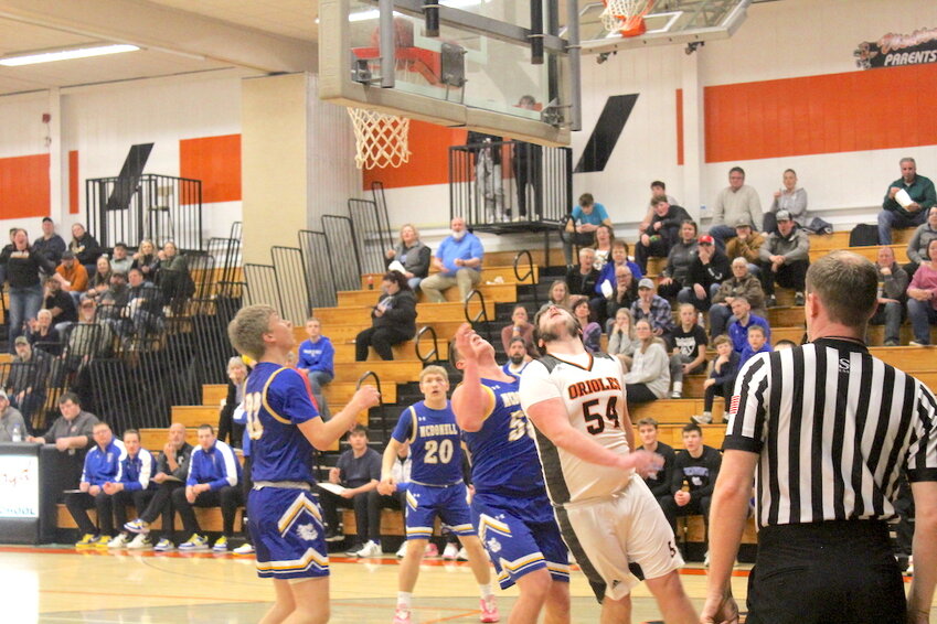 Riley Weltzin (54) makes a basket during the game against McDonell last week.