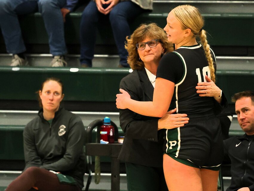 Park senior Tori Henderson gets a hug from head coach Stephanie Tolkinen as she wraps up her final home game.