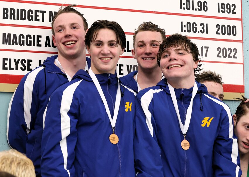 Thomas Foss, Taylor Schmaltz, Oliver Gergen and Tristan Herbst smile for the camera after a top three finish in the 200-yard freestyle relay.