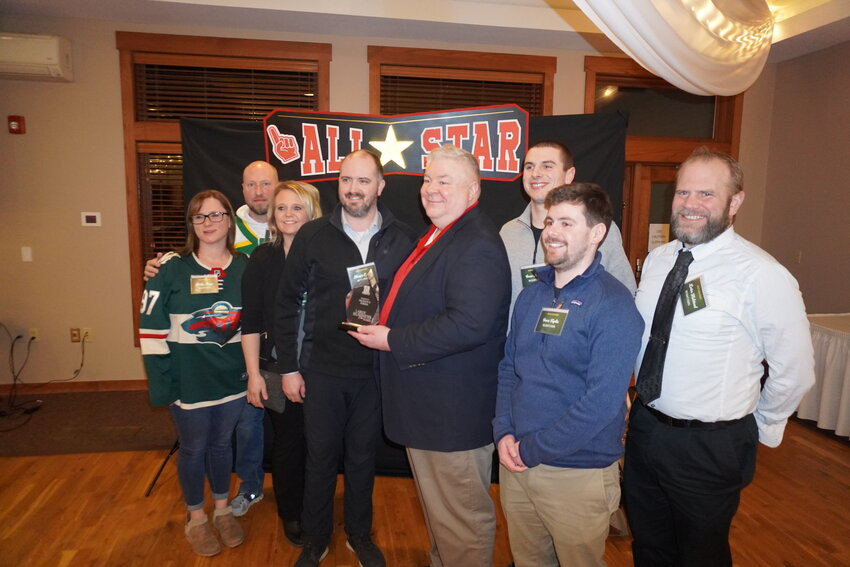 Ellsworth Chamber President Paul Bauer presented the Large Business of the Year Award to Nilssen&rsquo;s Foods and store manager Shawn Eggen, who was joined by store staff at the Ellsworth Area Chamber of Commerce Annual Awards Banquet.