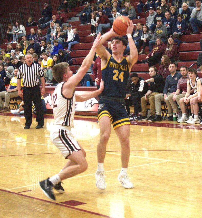 Joey Butz shoots for two in River Falls&rsquo; blowout victory over the Menomonie Mustangs on Thursday in Menomonie.
