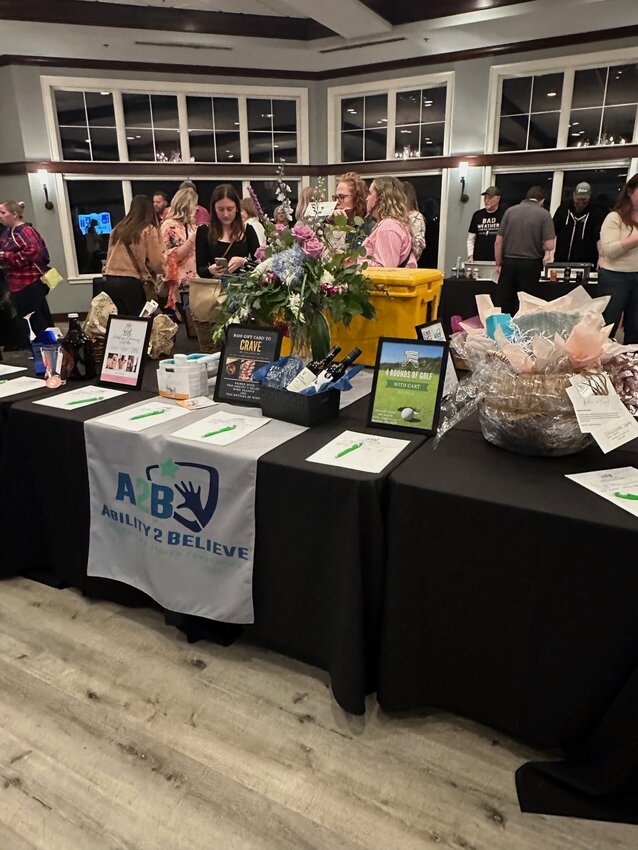 Silent auction items were bid on throughout the night. The donated prizes helped A2B to raise funds for its mission to help children and adults with special needs. Photo