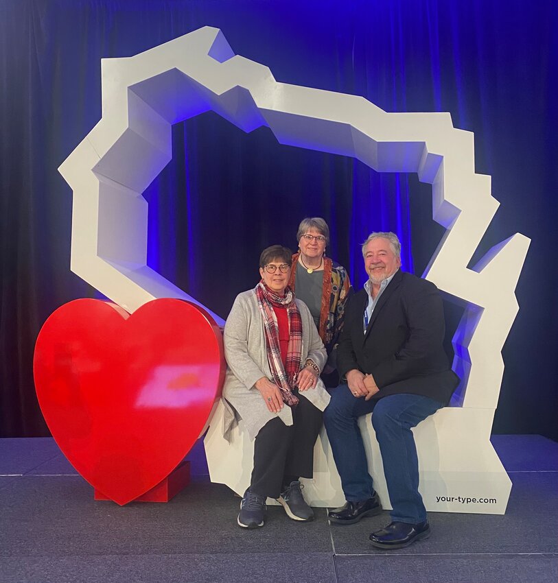 Hot Air Affair event directors Evy Nerbonne and Carla Timmerman with balloonmeister Ken Walter at the Wisconsin Governor&rsquo;s Conference on Tourism in Lake Geneva.