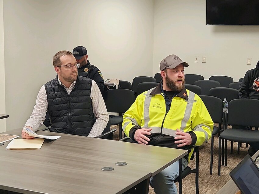 Eric Lynne (left) and Nick Martin (right) explain the difficult effluent limits imposed on the current wastewater treatment plant with hopes to increase to a more manageable limit.