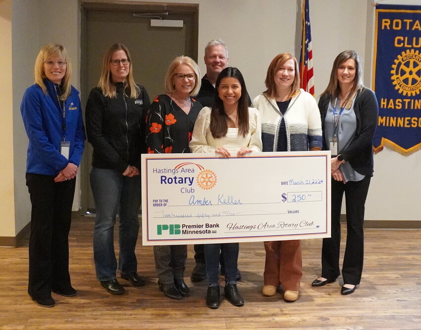 Amber Keller is pictured with Hastings School District representatives and her parents as she accepted the honor as Hastings High School Student of the Month for February at the Hastings Rotary Club meeting Thursday, March 21 at Second Street Depot.