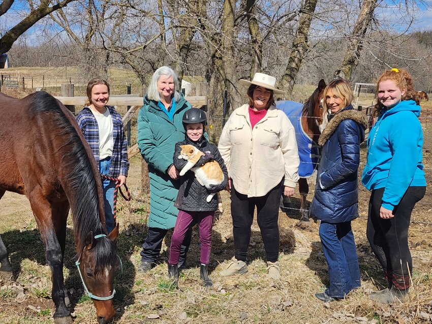 Members of the Lost Creek Ranch family, including Ruth Harper (middle with hat), founder Lynette Weldon (second from right) and Claire John (far right).