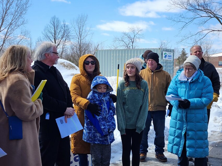 St. Croix Valley Habitat for Humanity Executive Director Kristie Smith and Pastor John Lestock introduce Taylor Johnson and her two children at the Panther Drive groundbreaking in Ellsworth Wednesday, March 27.