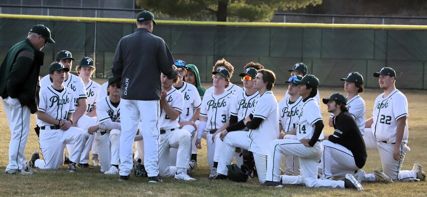 Park players listen to head coach Dave Darr after a season-opening 13-3 win over visiting Hastings Friday.