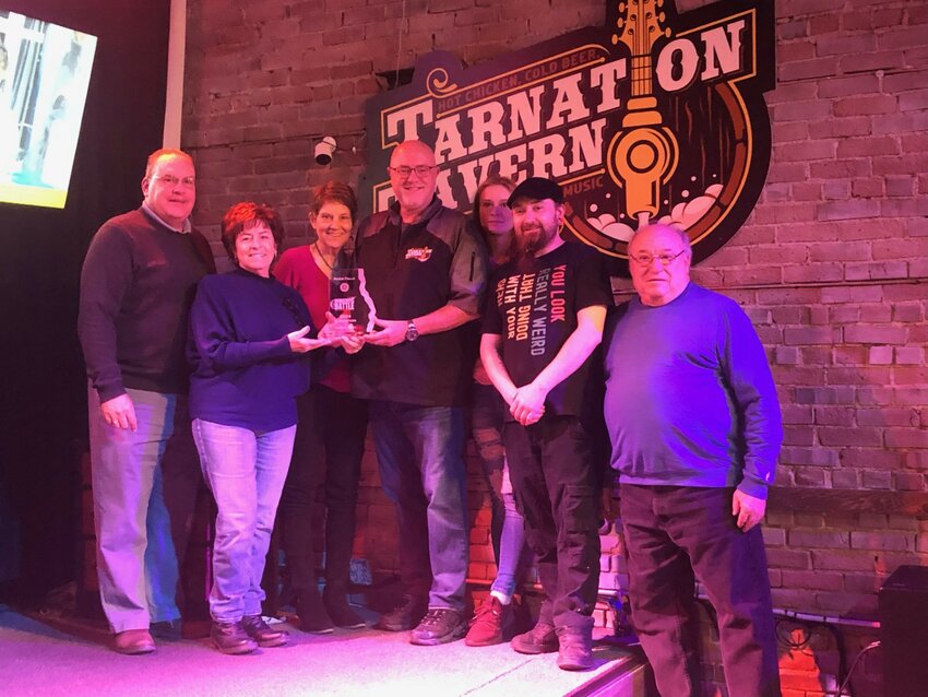 Members of the River Falls Rotary Club, including Scott Morrissette, Terry McKay and Linda Yde presented the 2024 Burger Battle award to Tarnation Tavern staff.