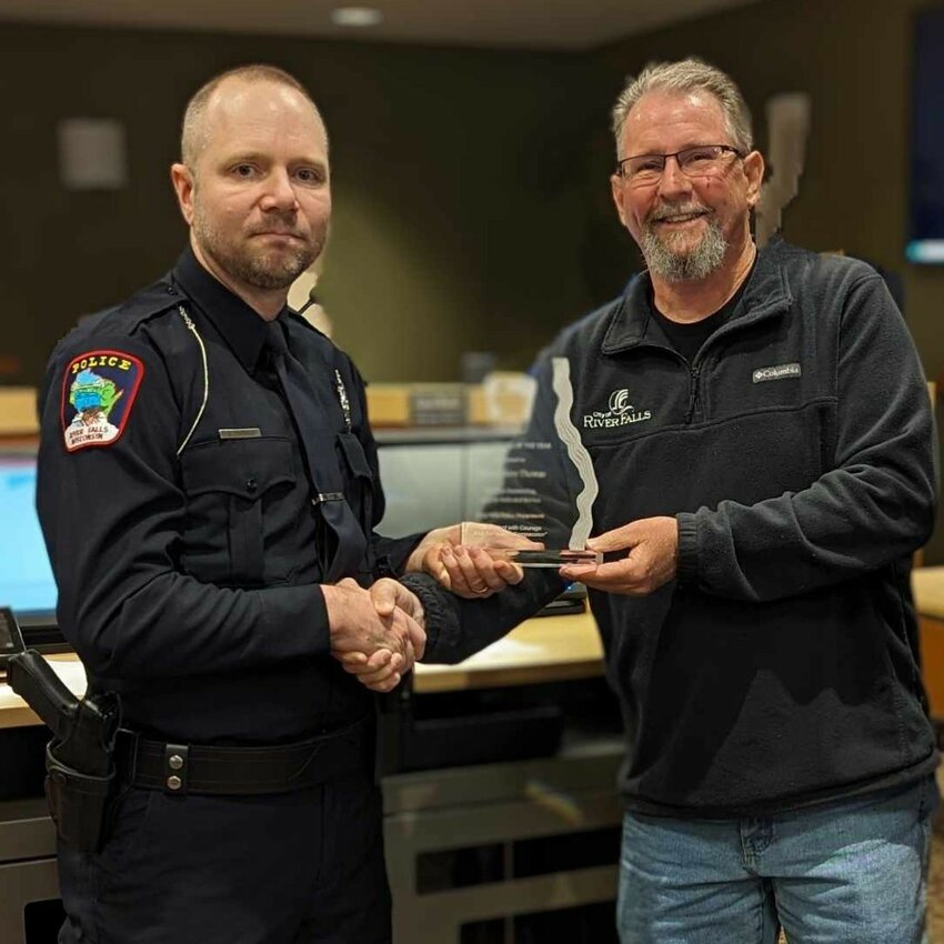 River Falls Mayor Dan Toland presented 2023 Officer of the Year Steven Thomas with a plaque at the March 26 River Falls City Council meeting.