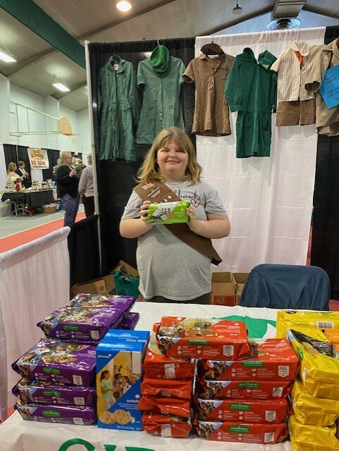 Girl Scout Lilly Anderson kept busy selling Girl Scout cookies with her mother by her side.