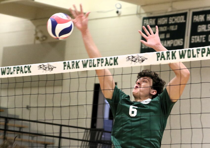 Park middle hitter Cole West goes up to block an Apple Valley shot in the first game Thursday.