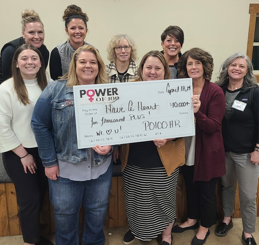 Have A Heart Director Wanda Burnley (in jean jacket) accepts the $10,000 Power of 100 Women – Roberts/Hammond award on April 18.