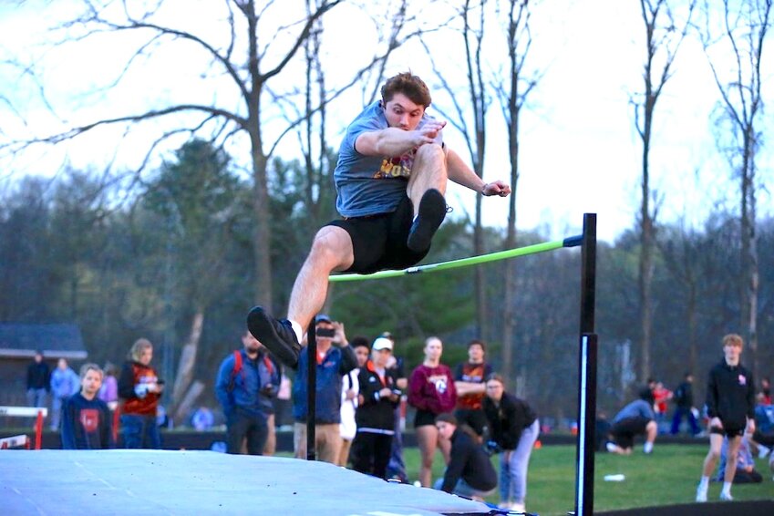 Chase Sturm scissor steps his way over the high jump bar at Neillsville.