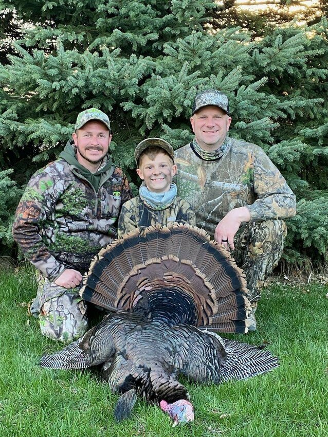 Successful hunters Justin &quot;Beaner&quot; Braun, Jameson Klug, and    his father Jim Klug.