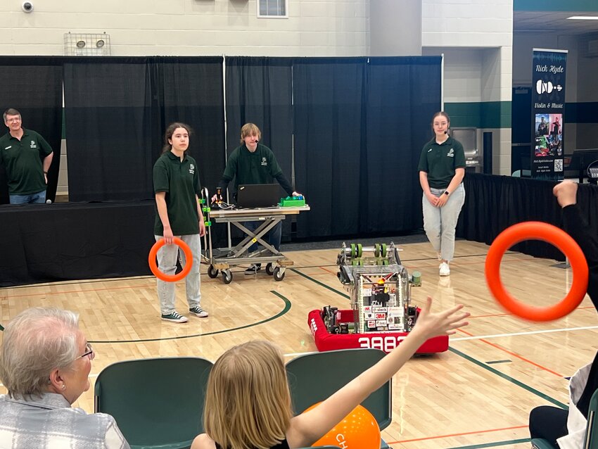 The Park High 3883 Data Bits Team gave a robotics demonstration Saturday at the Cottage Grove Community Showcase, with its machine programmed to toss hoops into the crowd.