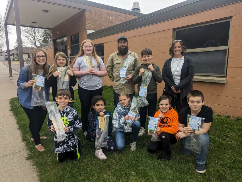 PPCS technician Matt Bauer (standing/center) delivered white pine seedlings to the fourth graders at Plum City Elementary on Arbor Day.