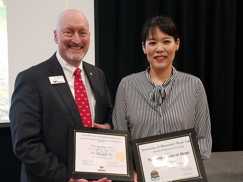 CAFES Dean Michael Orth with Youngmi Kim, the CAFES 2024 Outstanding Faculty recipient.
