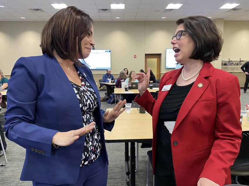 Chippewa Valley Technical College President Sunem Beaton-Garcia, left, and UW-River Falls Chancellor Maria Gallo converse during Tuesday&rsquo;s Reaffirmation Day in Eau Claire. The annual event reaffirms the commitment by UWRF and CVTC to work together to allow students to access programs at both institutions and transfer more easily.