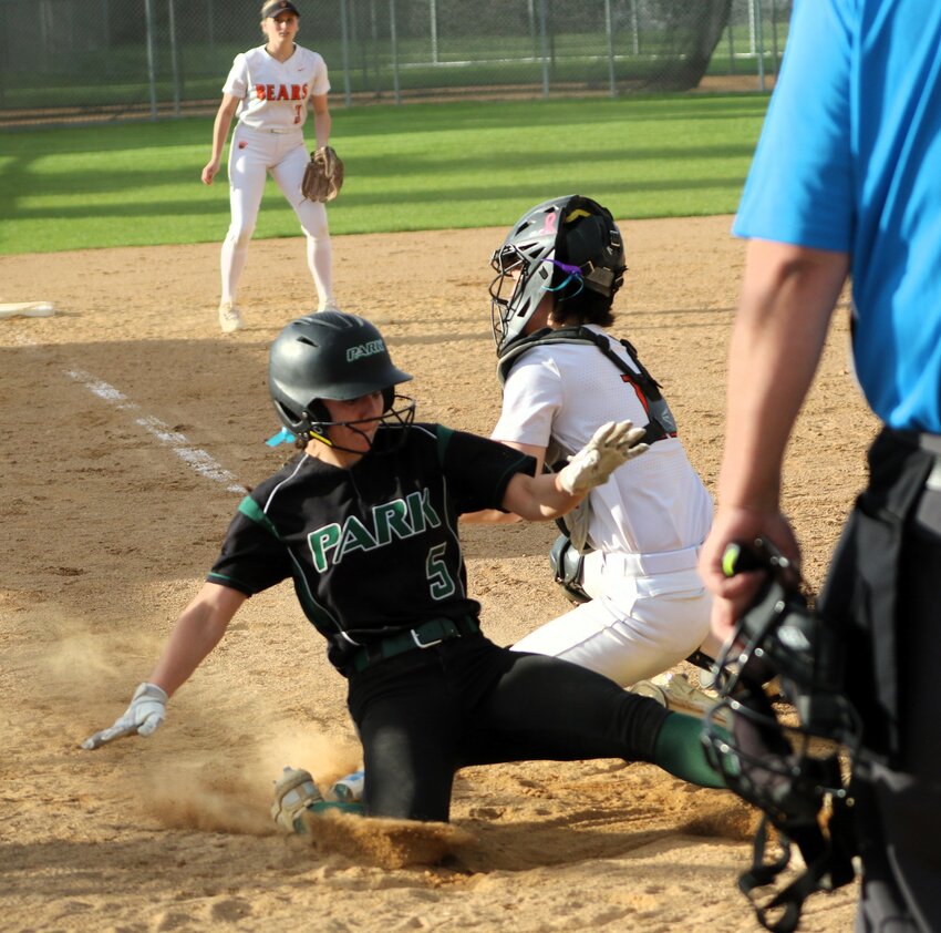 Addie Corkish of the Wolfpack slides home with the game-winning run against White Bear Lake in the eighth inning.